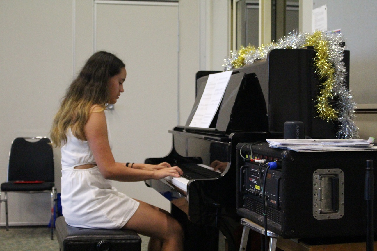 Student practigin piano lesson