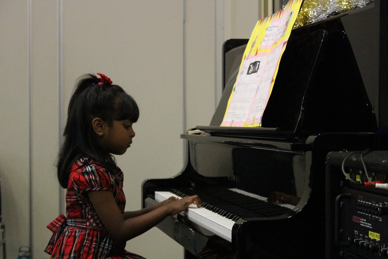 Student practigin piano lesson